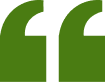 Green quotation mark symbol on a white background.